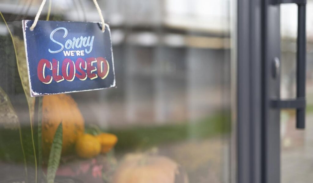 sorry-we-re-closed-sign-hanging-1-25384